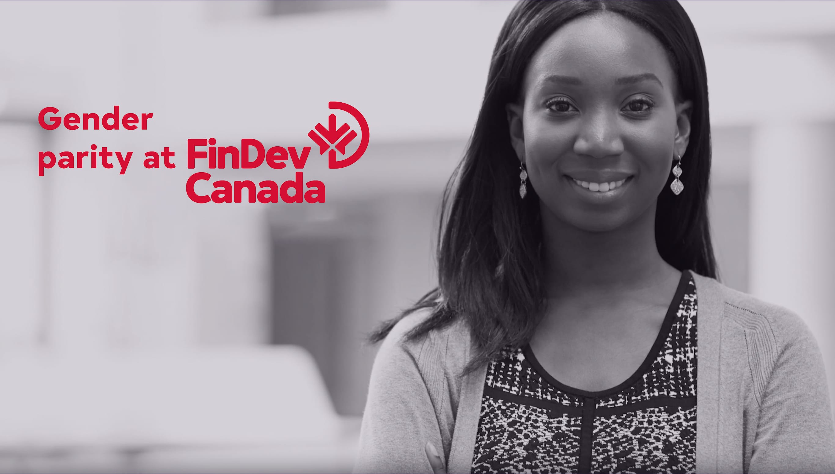 Young FinDev employee smiles in the workplace