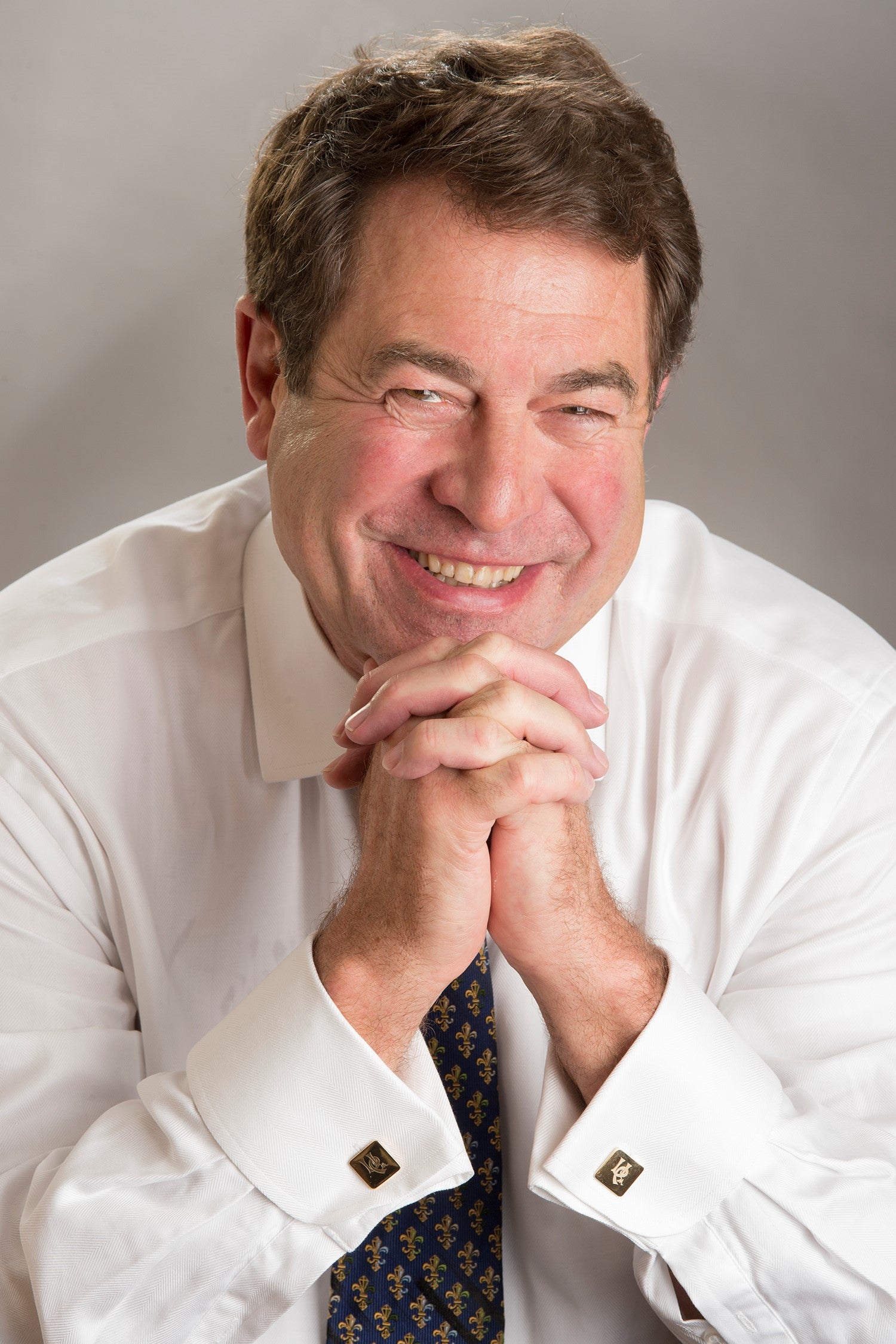 Image of man with brown hair smiling