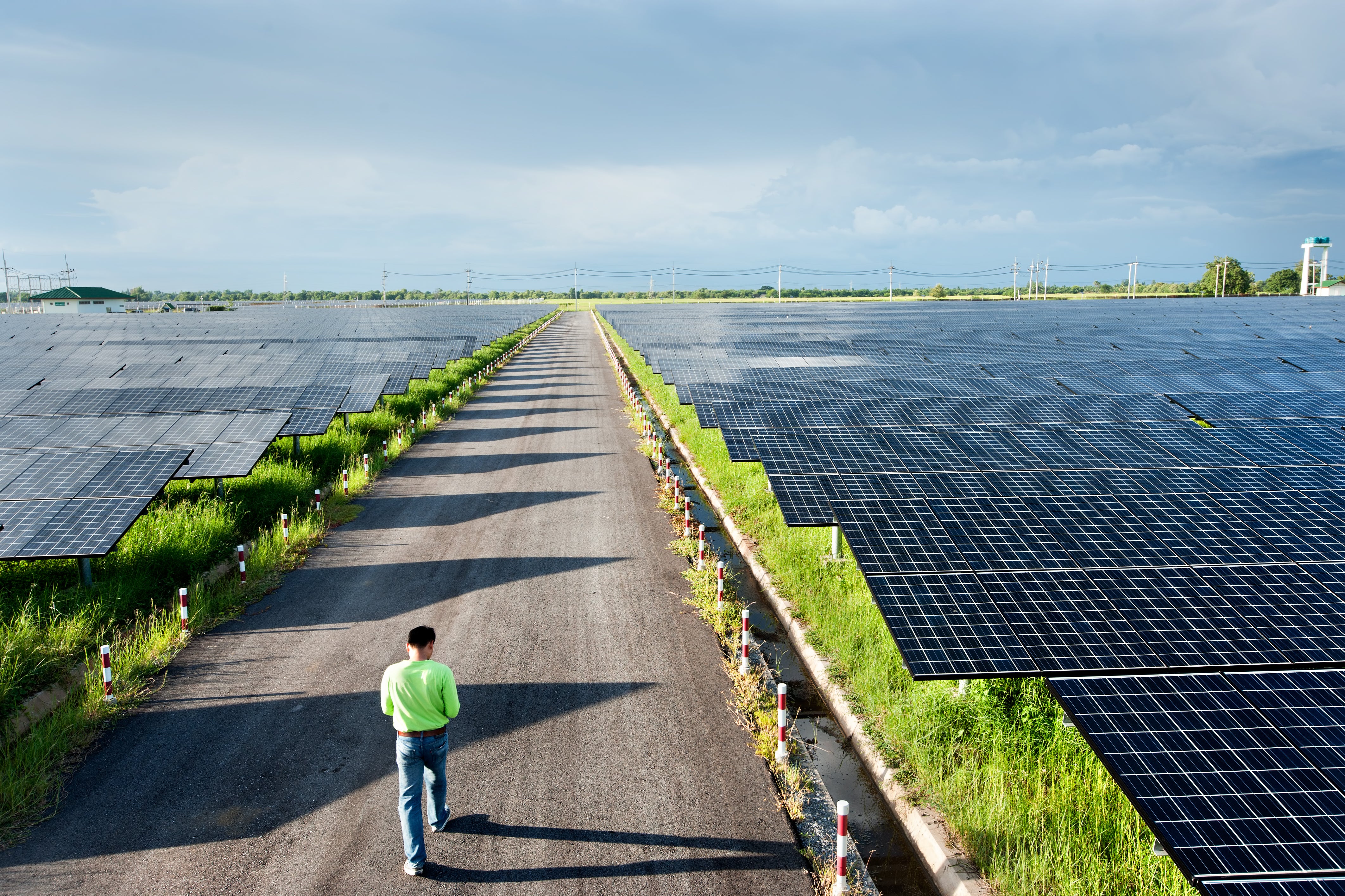 man working solar panel farm