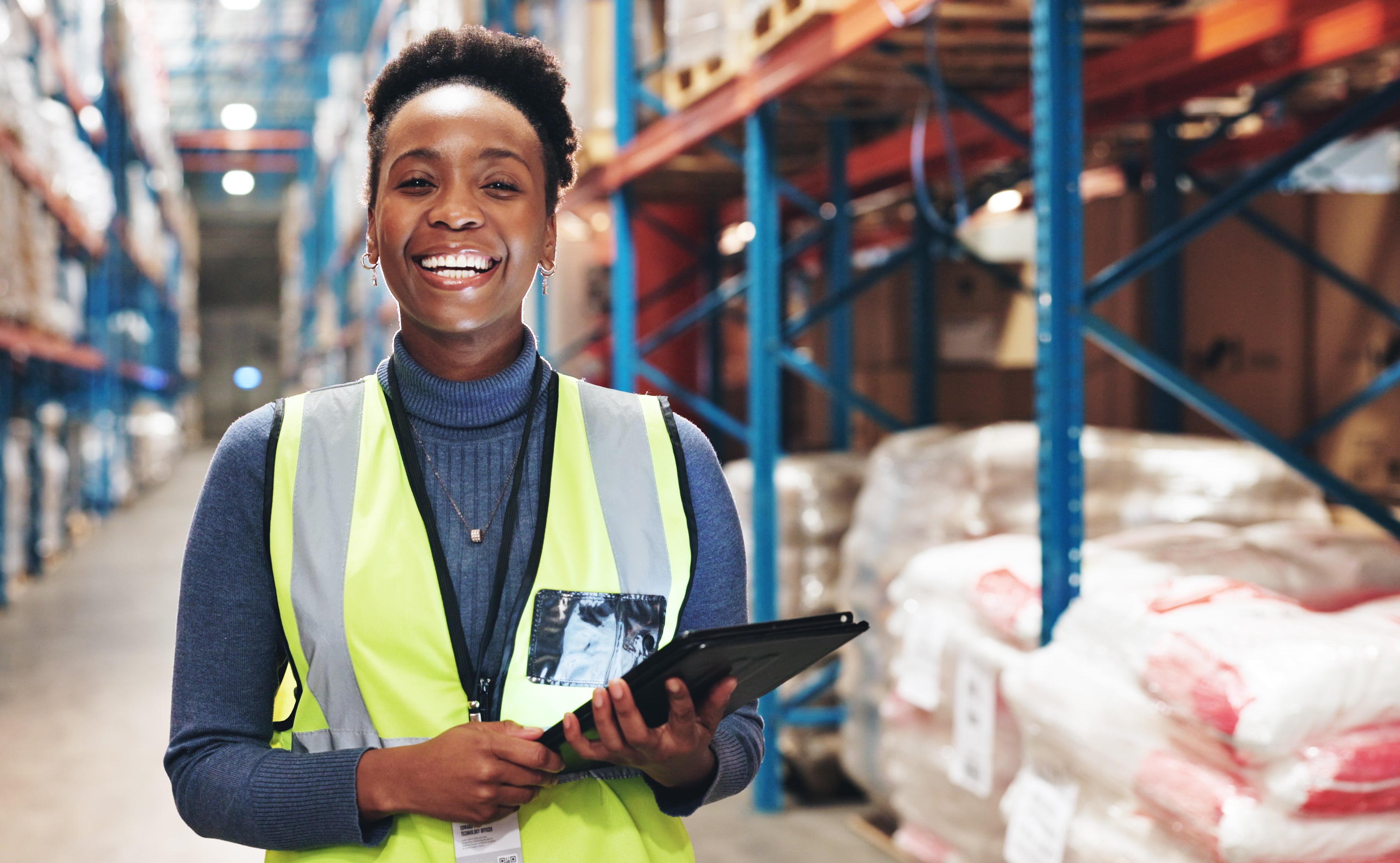 Woman smiling in a factory