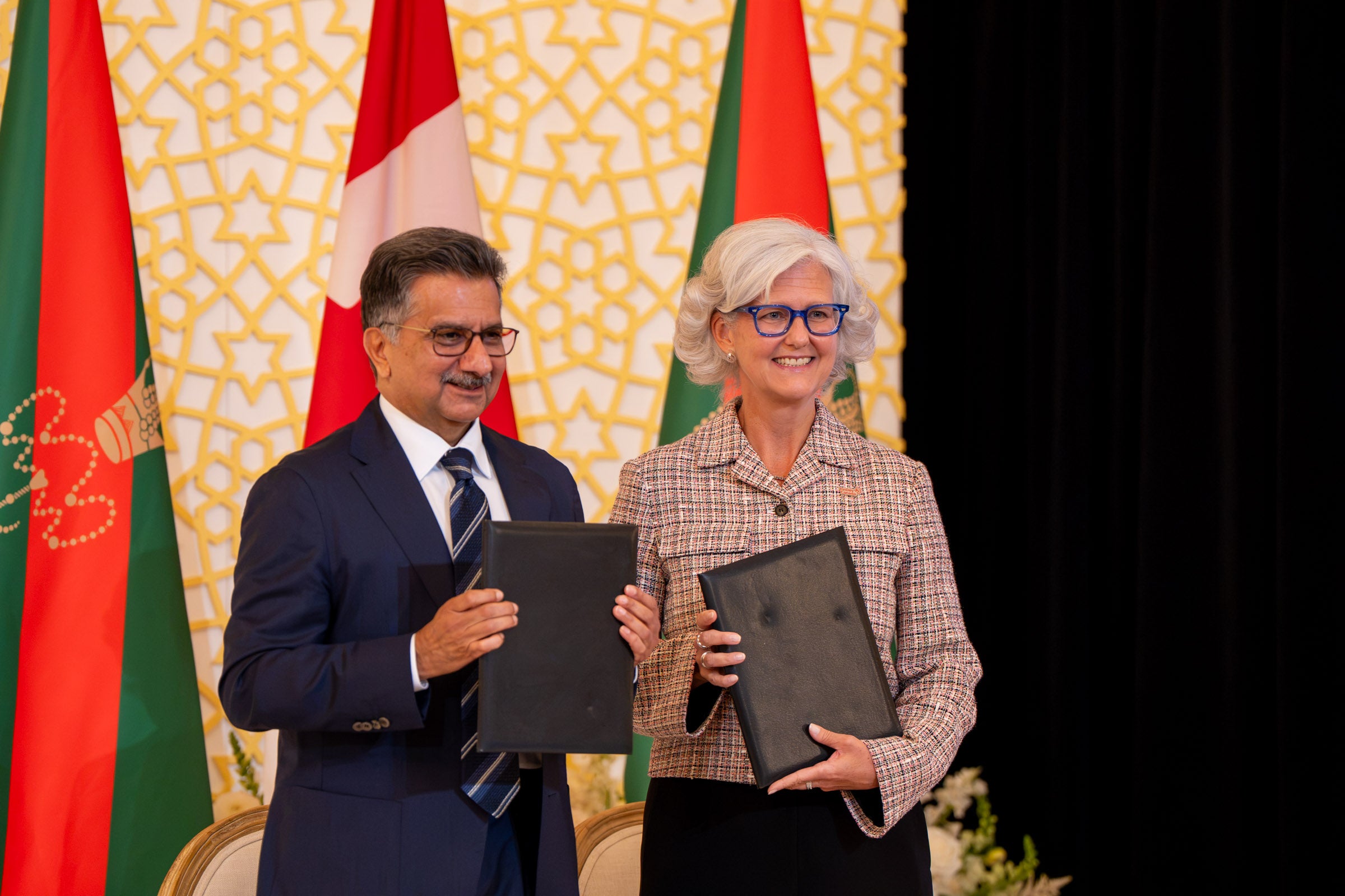 Picture of Lori Kerr and Sultan Allana at the MOU Signing Ceremony