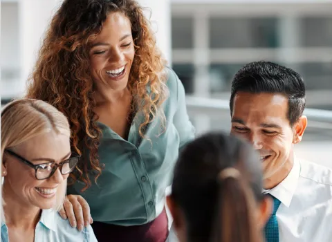 Colleagues talking and laughing