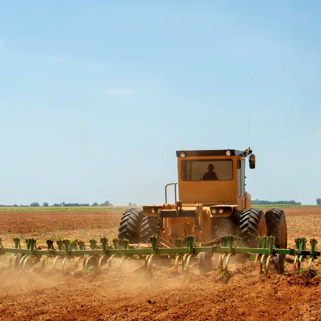 Tractor pushing dirt