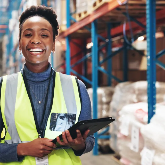 Woman smiling in a factory