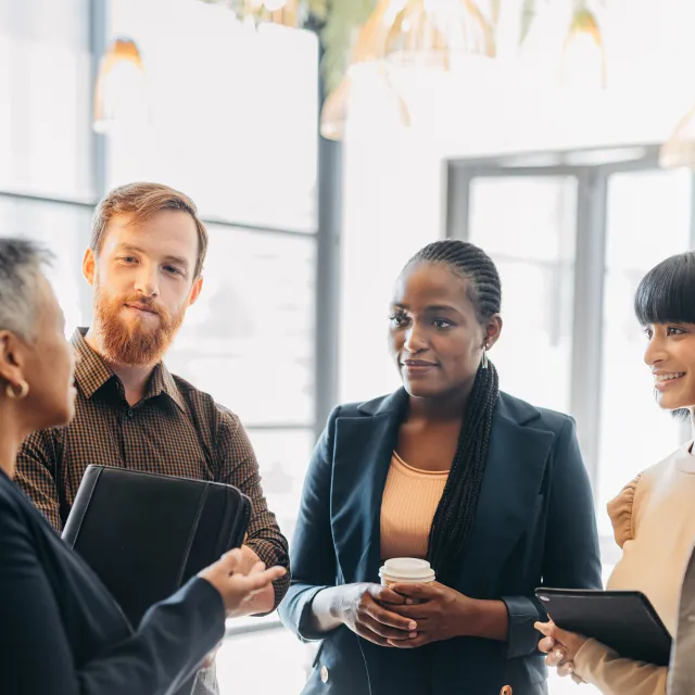 Group of colleagues discussing