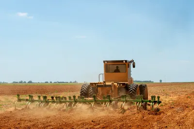 Tractor pushing dirt