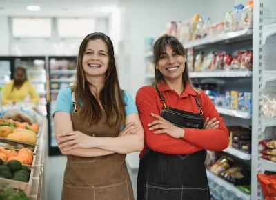 Women with arms crossed smiling