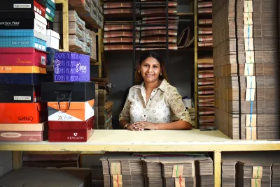 Cashier smiling at camera while working