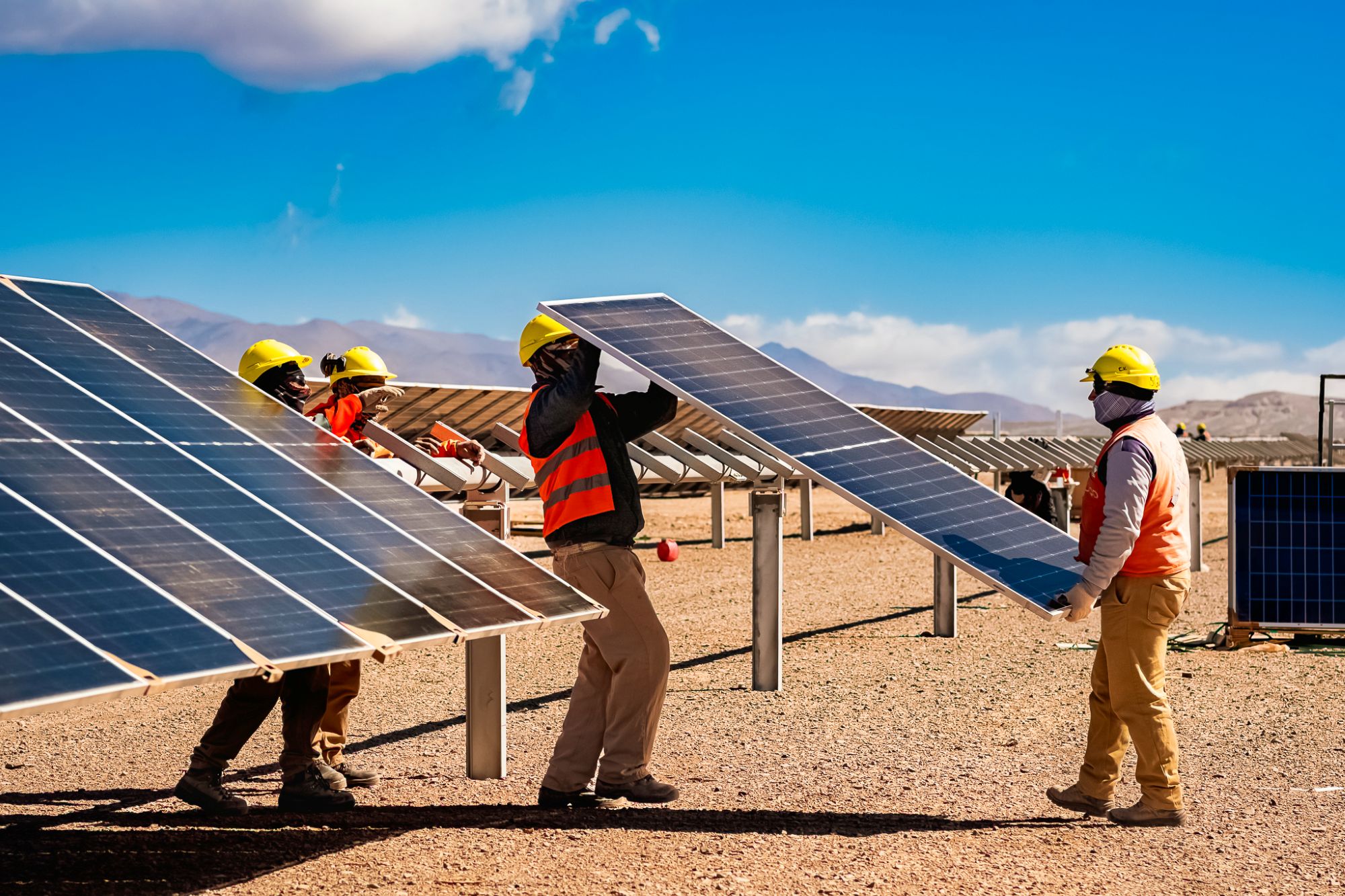 Workers are installing solar panels